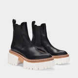 Platform Boots in Black Synthetic Leather