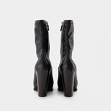 Cowboy Boots in Black Synthetic Leather